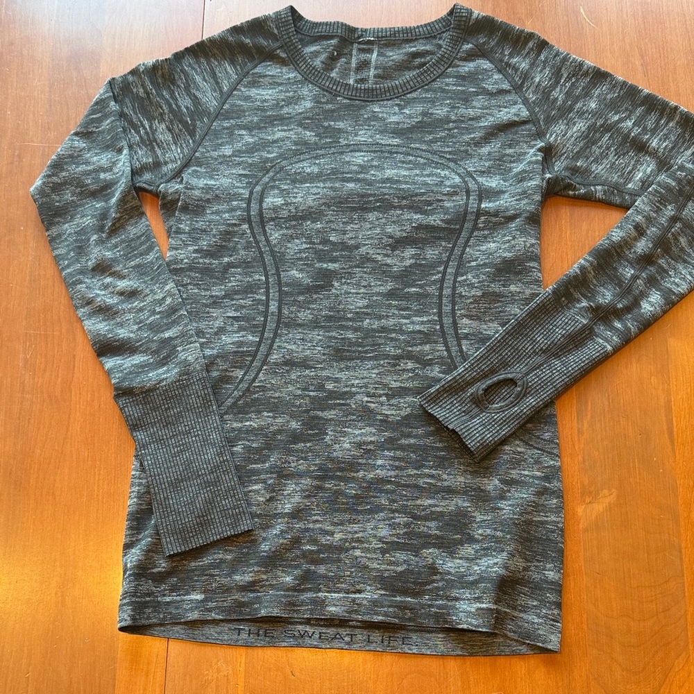 Lululemon Women’s long sleeved Swiftly size 10 heathered gray/black color.